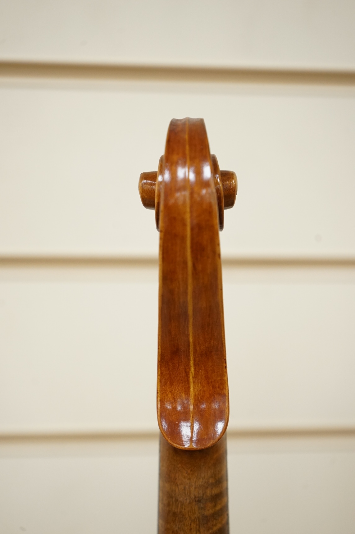 Four violins; a German Dresden violin, together with further two German violins, and a Saxony violin, three in cases or the remains of cases.